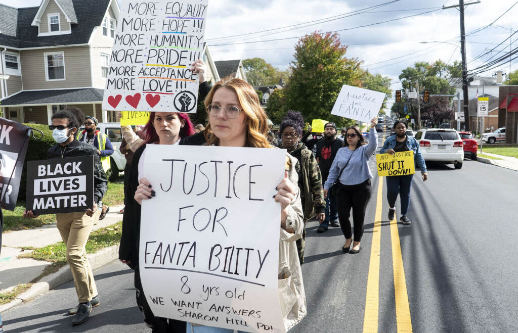 [in center]: Taylor Kowalski, from Ridley Park, marching alongside others.
The Justice for Fanta Bility silent march in Sharon Hill, PA on 10/17/21. Fanta Bility was an eight year old girl who was shot and killed outside of a football game at Academy Park High School on August 27, 2021. The march had been organized and  led by the UDTJ and Delco Resists as a way to honor Fanta’s life as well as call for police accountability. 
[DANIELLA HEMINGHAUS]