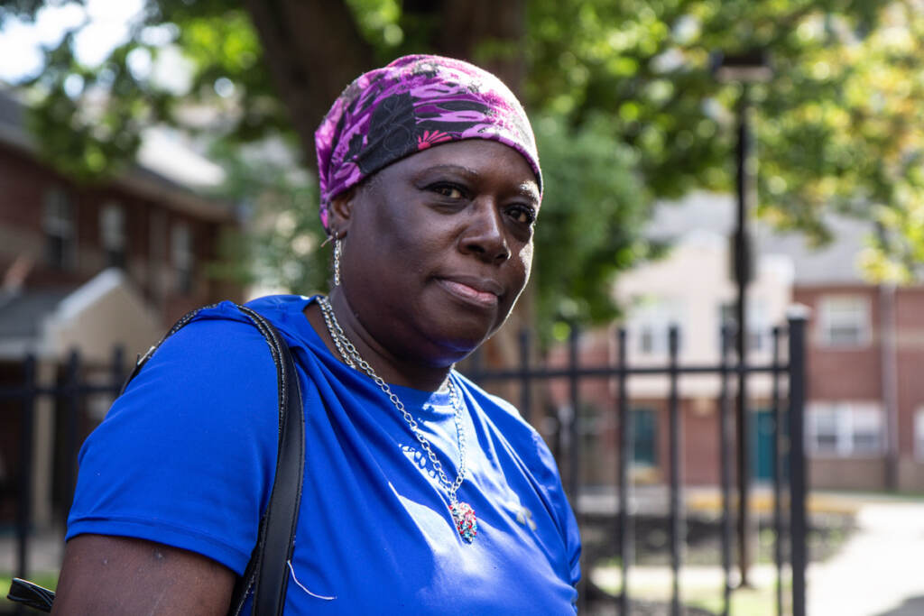 IMG_5029 Karen Mouzone, a resident of the University City Townhomes, said that she and other affordable housing residents should not be removed from their homes, at a protest at 39th and Market Streets on October 14, 2021. (Kimberly Paynter/WHYY)