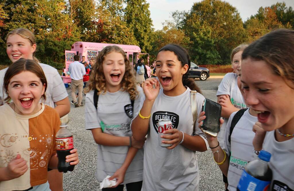 Members of the Delran Football Club get loud for Carli Lloyd. Hundreds attended a celebration of the hometown hero’s soccer career at Delran Community Park