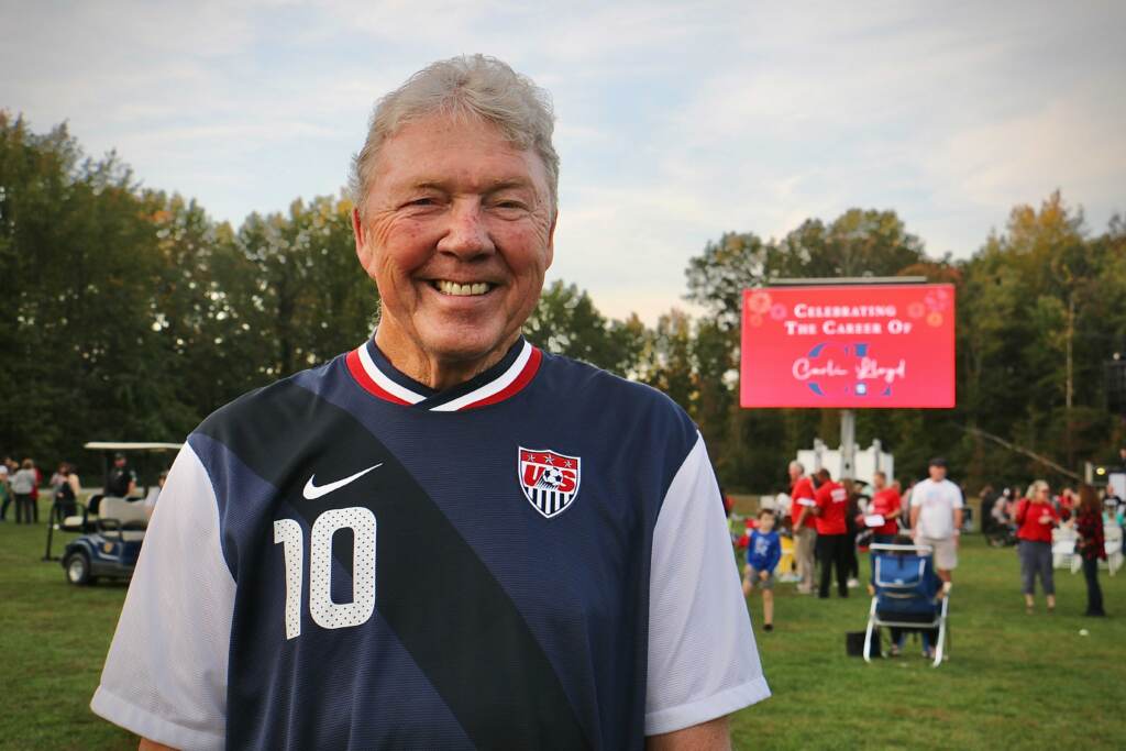 Carli Lloyd’s uncle Wayne Wilson, 75, who traveled all over Europe to watch her play, arrives at her retirement celebration at Delran Community Park wearing her jersey