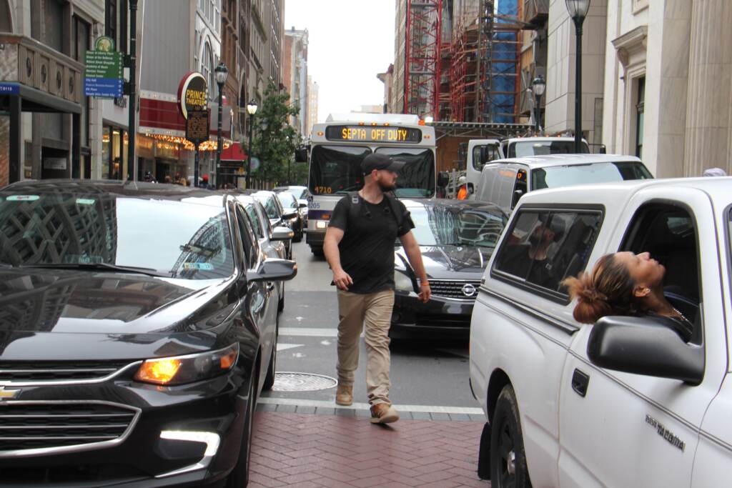 a-pedestrian-threads-his-way-through-snarled-traffic-at-broad-and-chestnut-streets-emma-lee-whyy.original A pedestrian threads his way through snarled traffic