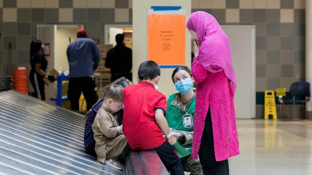 Children and adult from Afghanistan at PHL Airport (David Rosenblum/ BillyPenn)
