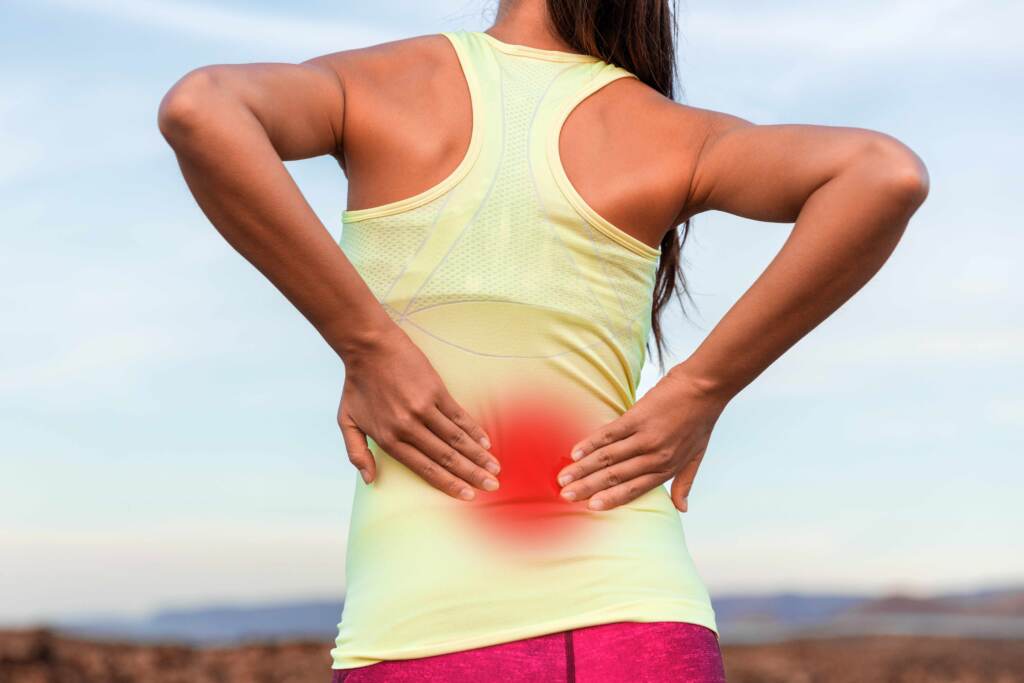 bigstock-Back-pain-sport-injury-woman-w-395205812-web A woman with inflammed area in red halo on her lower back