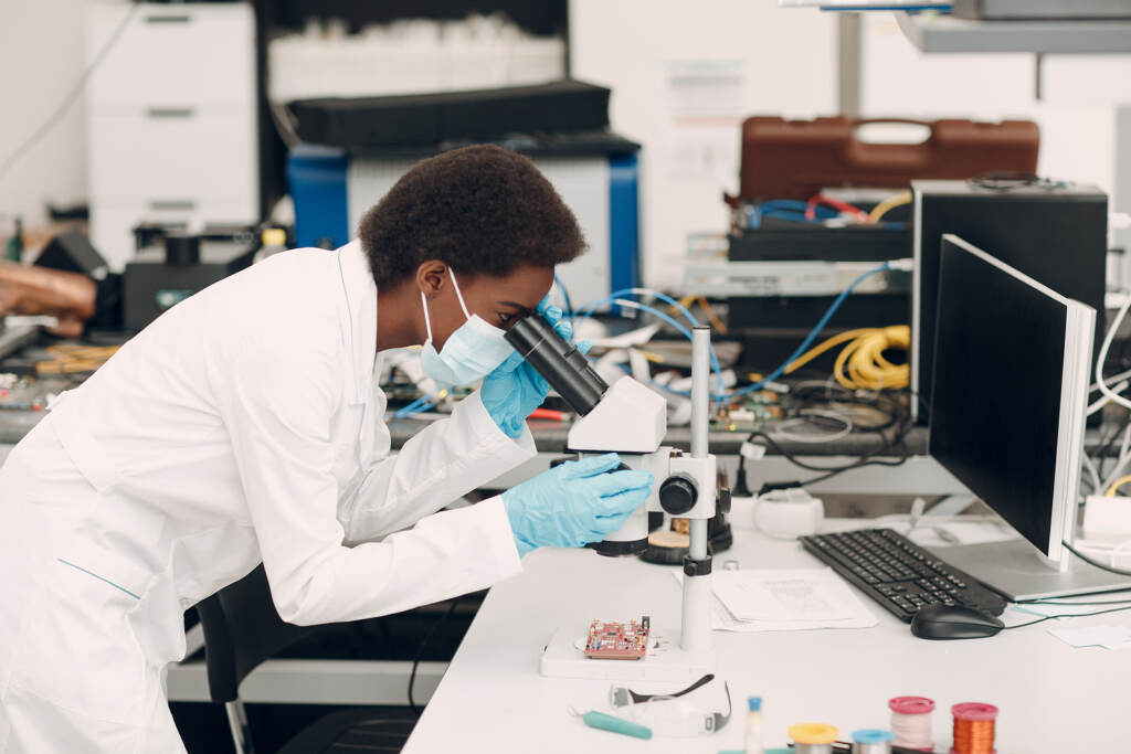 Scientist African American Woman Engineer Working In Laboratory Female scientist working in a lab.