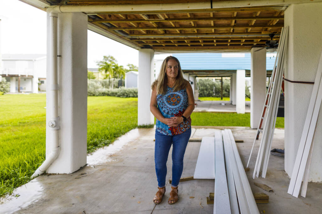 Rebecca Horan stands outside on a back patio