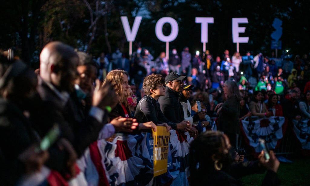 Attendees listen to former President Barack Obama during an early vote rally for New Jersey Gov. Phil Murphy on Oct. 23 in Newark, N.J. That gubernatorial race and the one in Virginia are drawing national attention one year after the presidential election. Attendees listen to former U.S. President Barack Obama during an early vote rally for New Jersey Gov. Phil Murphy on October 23, 2021 in Newark, New Jersey. People are heading to the polls in New Jersey for early voting as Governor Murphy faces Republican challenger Jack Ciattarelli. (Photo by Eduardo Munoz Alvarez/Getty Images)