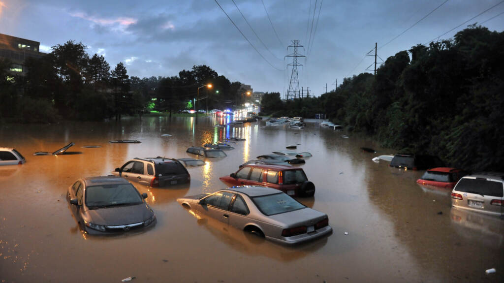 Flooding in Reston, VA Cars submerged in floodwaters in a parking lot
