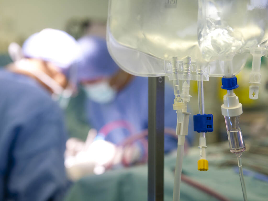 Surgeons remove the liver and kidneys of a deceased donor, for later transplantation. Doctors perform surgery