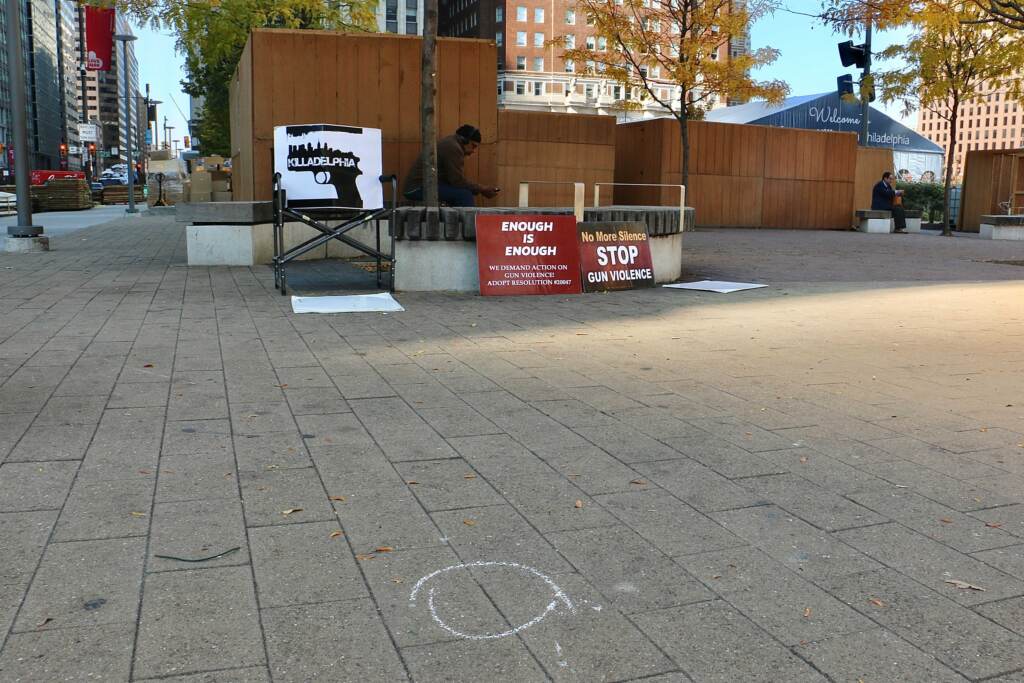 2021-11-10-e-lee-gun-violence-protest-love-park-3 A chalk circle marks the place where a bullet casing landed during a fatal shooting in LOVE Park Tuesday night