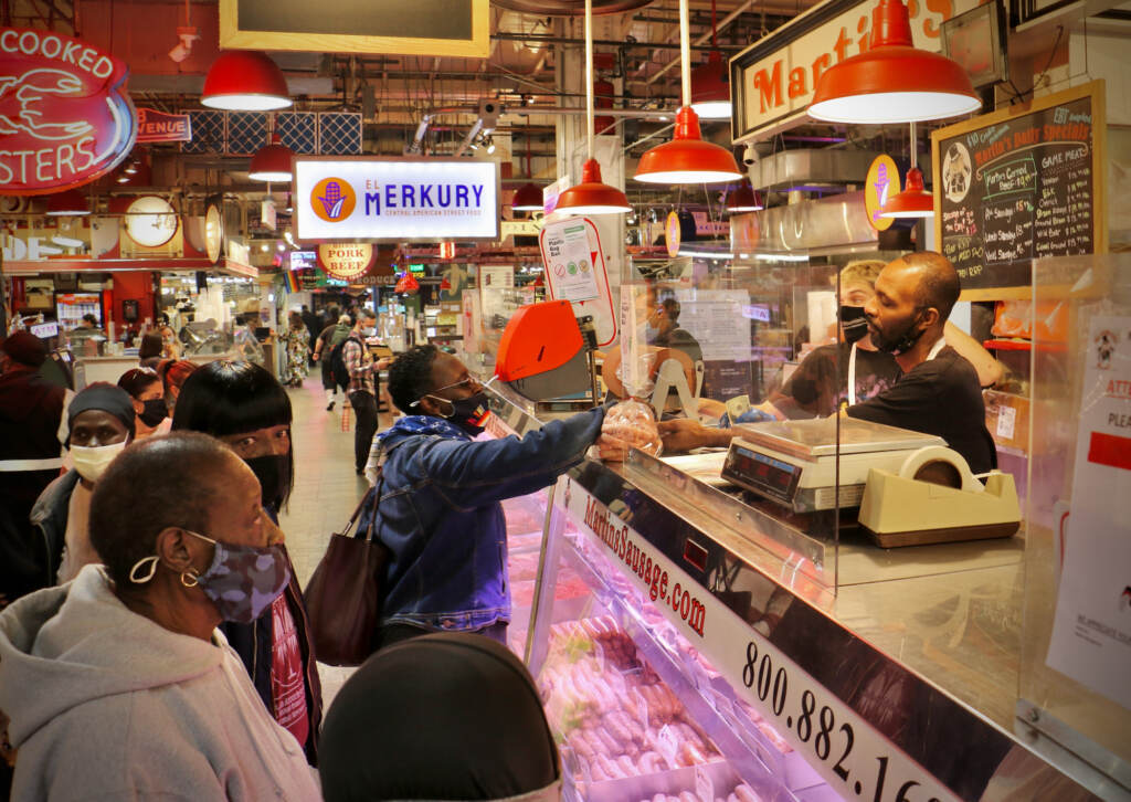2021 11 17-e lee-philadelphia reading terminal market martins-meat counter inflation Customers line up at the meat counter
