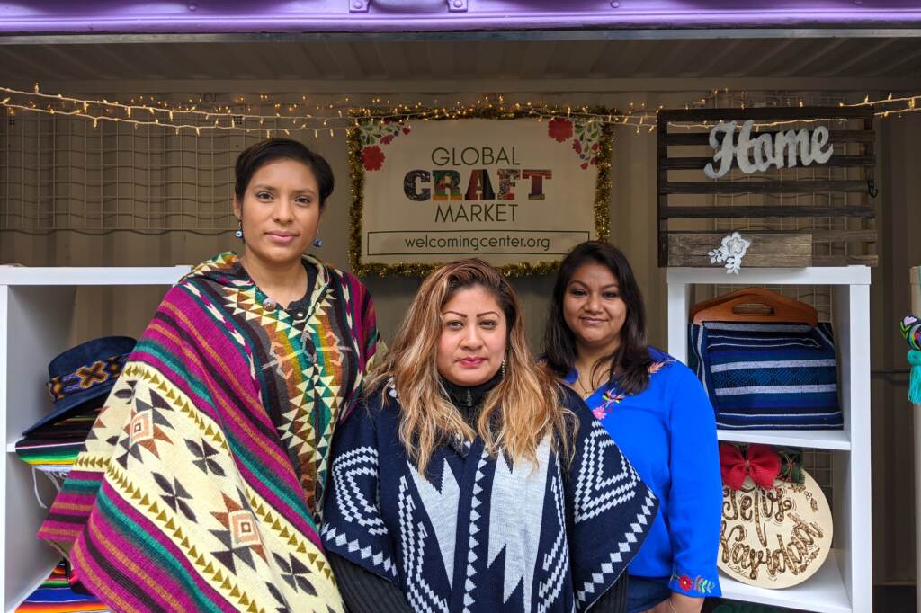 2021-11-22-e-estrada-mercado-de-latinas Tania Greene, Reyna Navarro and Tania León are selling at the Christmas Village for the first time. (Elizabeth Estrada/WHYY)