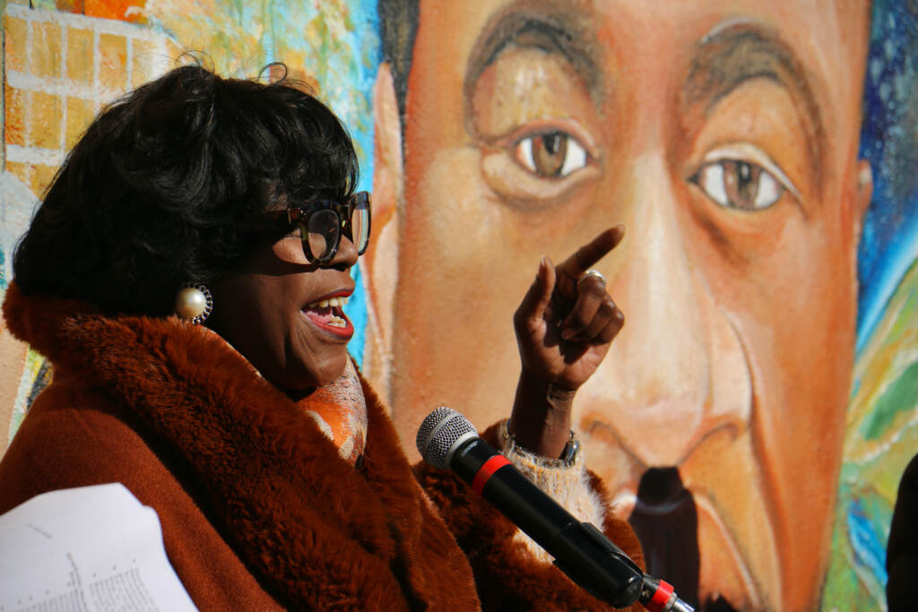 2021 11 23-e lee-cherelle parker-philadelphia 5th and olney tang pharmacy-george floyd tribute mural Cherelle Parker speaking in front of a George Floyd mural.