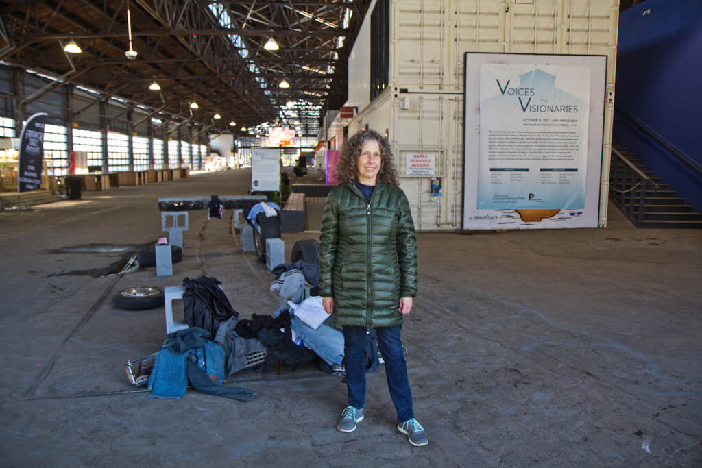 2021 11 5 k paynter cherry street pier art show flood Leslie Kaufman, curator or Voices and Visions, a sculpture show at Cherry Street Pier in Philadelphia, stands by a piece that was damaged in flooding the last week of October, 2021