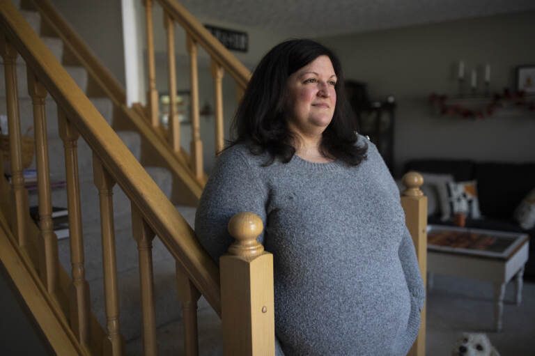 Lauren Barber stands in her home in Columbus, Ohio, on Nov. 16. Barber has been inundated with offers from investors and companies that want to buy her house. She sometimes gets called or texted more than five times a day with offers.
(Maddie McGarvey / NPR)