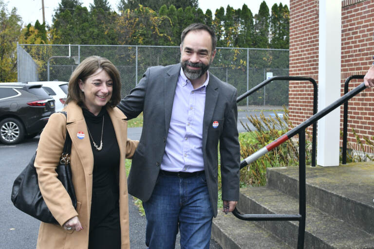 Kevin Brobson walks with his wife, Lauren