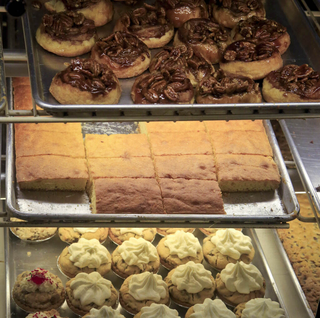 Sticky buns, cornbread, and chocolate chip pies in a bakery's display case. (AP Photo/Bebeto Matthews)