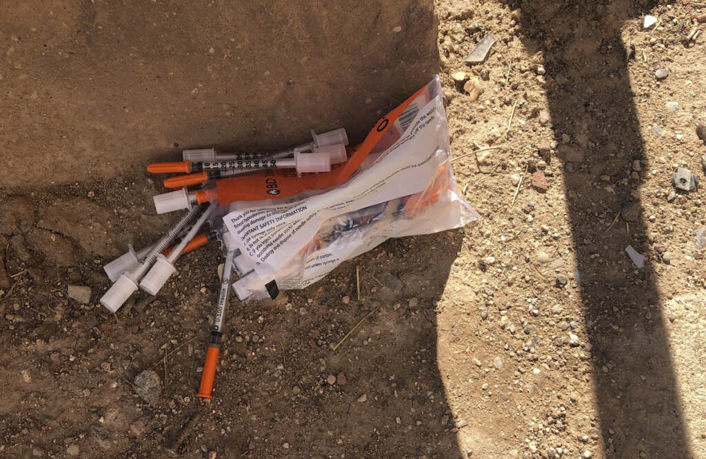 Heroin Needles App A package of unused syringes and needles is found next to a vacant building in northeast Albuquerque, New Mexico, where crews attempted to clear the lot of used needles and other heroin paraphernalia on Friday, Aug. 9, 2019. Bernalillo County officials have launched a digital mapping tool to track the places where heroin needles and syringes are found in New Mexico's largest city