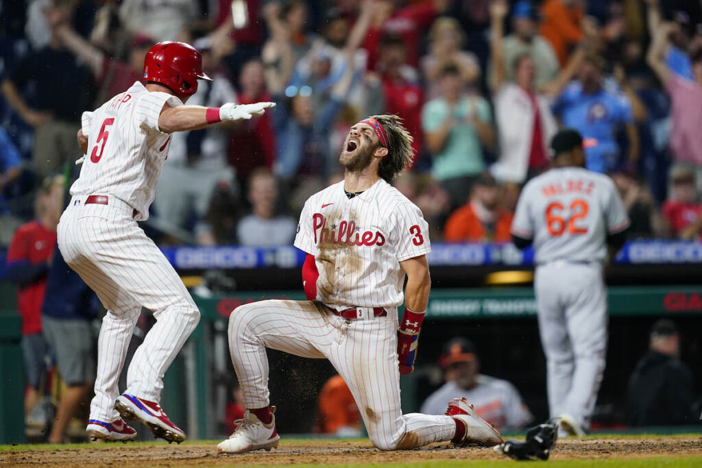 APTOPIX Orioles Phillies Baseball Philadelphia Phillies' Bryce Harper (3) and Andrew Knapp (5) celebrate after Harper scored the game-winning run on a two-run triple by J.T. Realmuto during the 10th inning of an interleague baseball game against the Baltimore Orioles, Tuesday, Sept. 21, 2021, in Philadelphia
