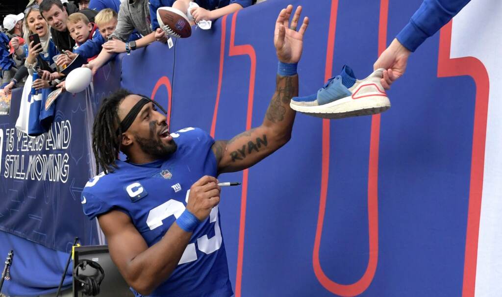 Panthers Giants Football Logan Ryan New York Giants safety Logan Ryan (23) signs autographs as he walks off the field after the Giants defeated the Carolina Panthers 25-3 in an NFL football game Sunday, Oct. 24, 2021, in East Rutherford, N.J.