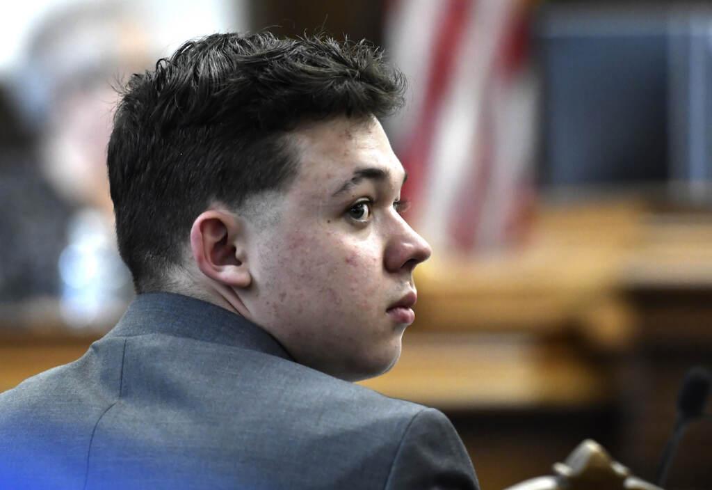 APTOPIX Kenosha Protests Shootings Kyle Rittenhouse looks back at the potential juror pool during the jury selection process at the Kenosha County Courthouse in Kenosha, Wis., Monday, Nov. 1, 2021. Rittenhouse is accused of killing two people and wounding a third during a protest over police brutality in Kenosha, last year. (Sean Krajacic/The Kenosha News via AP, Pool)