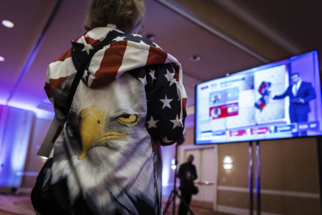 Election 2021 New Jersey Governor A person wearing an eagle on the back of their hoodie watches the incoming results for New Jersey at the election night party for Republican gubernatorial candidate Jack Ciattarelli, held at the Bridgewater Marriott hotel in Bridgewater, N.J., Tuesday, Nov. 2, 2021