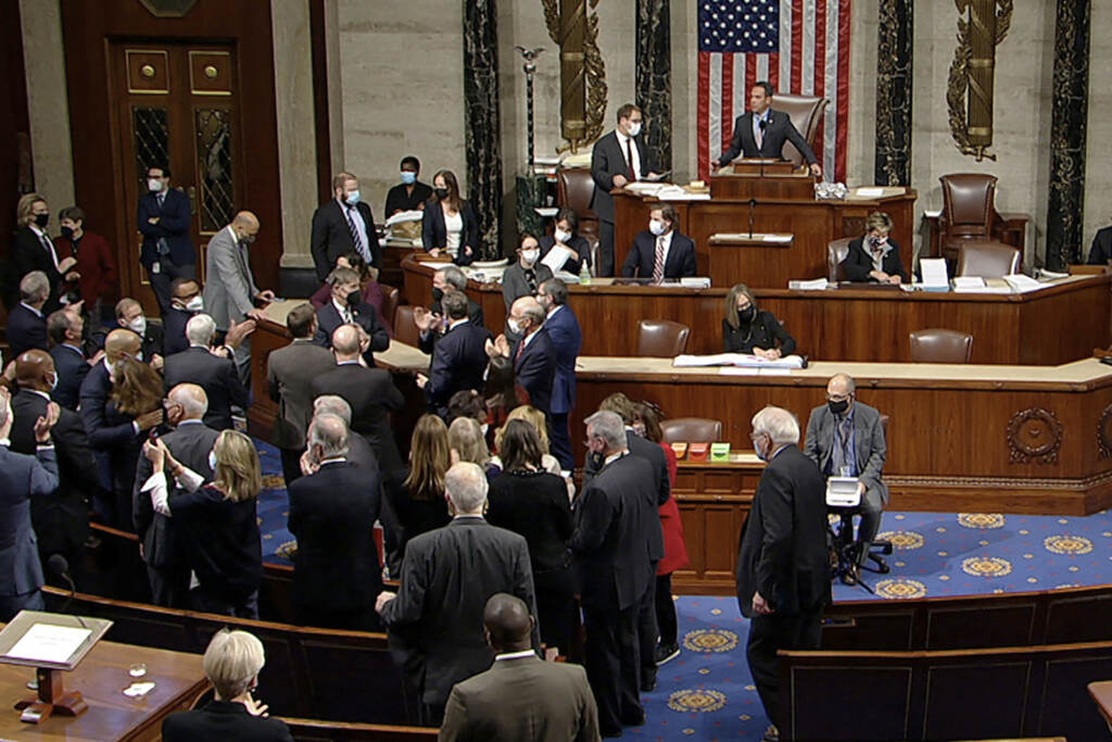 Congress Budget In this image from House Television, Democrats celebrate on the House floor late Friday, Nov. 5, 2021, in Washington, after the House approved a $1 trillion package of road and other infrastructure projects after Democrats resolved a months-long standoff between progressives and moderates, notching a victory that President Joe Biden and his party had become increasingly anxious to claim