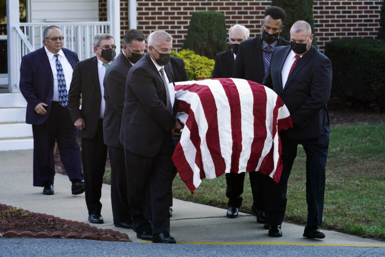 The flag-draped casket of former Delaware Gov. Ruth Ann Minner is carried out of the Church of Nazarene after a funeral service in Milford, Del., Wednesday, Nov. 10, 2021. (AP Photo/Andrew Harnik)