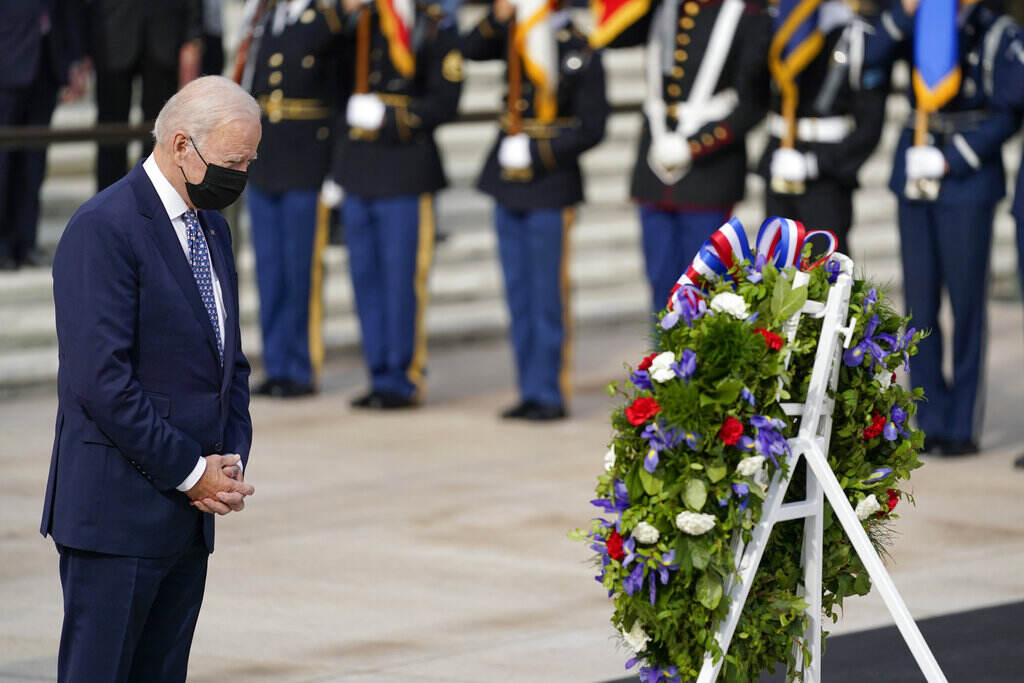 Biden Veterans Day Arlington President Joe Biden stands during a wreath laying ceremony to commemorate Veterans Day and mark the centennial anniversary of the Tomb of the Unknown Soldier at Arlington National Cemetery, Thursday, Nov. 11, 2021, in Arlington, Va. (AP Photo/Evan Vucci)