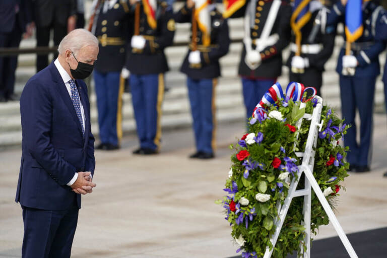 President Joe Biden stands during a wreath laying ceremony to commemorate Veterans Day and mark the centennial anniversary of the Tomb of the Unknown Soldier at Arlington National Cemetery, Thursday, Nov. 11, 2021, in Arlington, Va. (AP Photo/Evan Vucci)