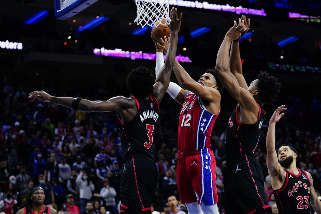 Raptors 76ers Basketball Philadelphia 76ers' Tobias Harris (12) goes up for a shot against Toronto Raptors' OG Anunoby (3), Scottie Barnes (4) and Fred VanVleet (23) during the second half of an NBA basketball game, Thursday, Nov. 11, 2021, in Philadelphia