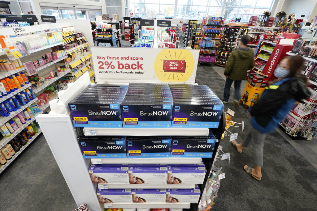 Home Tests Virus Outbreak Boxes of BinaxNow home COVID-19 tests made by Abbott and QuickVue home tests made by Quidel are shown for sale Monday, Nov. 15, 2021, at a CVS store in Lakewood, Wash., south of Seattle. After weeks of shortages, retailers like CVS say they now have ample supplies of rapid COVID-19 test kits, but experts are bracing to see whether it will be enough as Americans gather for Thanksgiving and new outbreaks spark across the Northern and Western states