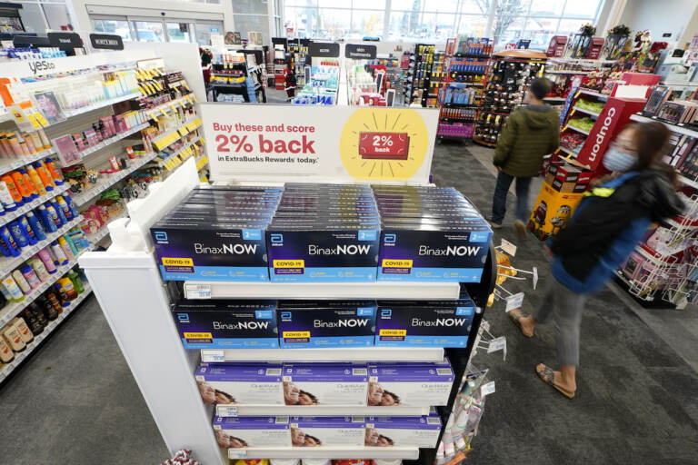 Boxes of BinaxNow home COVID-19 tests made by Abbott and QuickVue home tests made by Quidel are shown for sale Monday, Nov. 15, 2021, at a CVS store in Lakewood, Wash., south of Seattle. After weeks of shortages, retailers like CVS say they now have ample supplies of rapid COVID-19 test kits, but experts are bracing to see whether it will be enough as Americans gather for Thanksgiving and new outbreaks spark across the Northern and Western states
