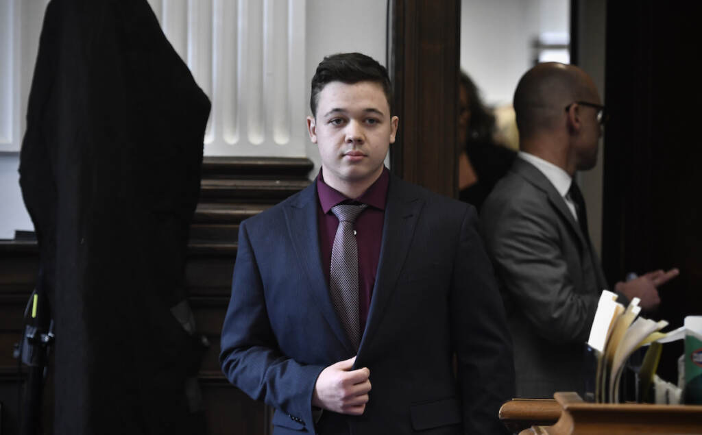 Kenosha Protest Shootings Kyle Rittenhouse enters the courtroom to hear the verdicts in his trial at the Kenosha County Courthouse in Kenosha, Wis., on Friday, Nov. 19, 2021. Rittenhouse has been acquitted of all charges after pleading self-defense in the deadly Kenosha shootings that became a flashpoint in the nation’s debate over guns, vigilantism and racial injustice. The jury came back with its verdict afer close to 3 1/2 days of deliberation