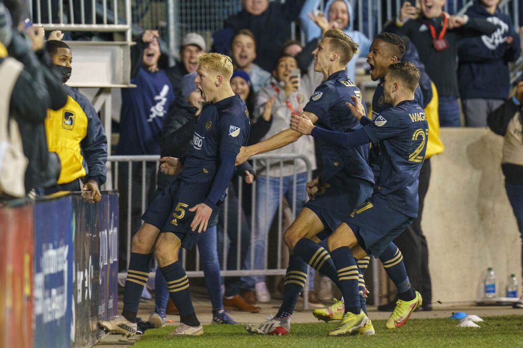 MLS Red Bulls Union Soccer Philadelphia Union's Jakob Glesnes, left, celebrates his goal with fans and teammates during extra time in an MLS playoff soccer match against the New York Red Bulls, Saturday, Nov. 20, 2021, in Chester, Pa. The Union won 1-0 in extra time.