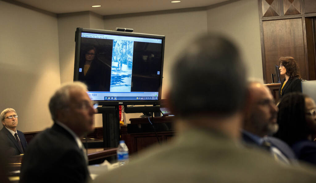 Ahmaud Arbery Georgia Trial Prosecutor Linda Dunikoski, far right, plays a video the jury asked to see as part of their deliberation during the trial of Greg McMichael and his son, Travis McMichael, and a neighbor, William