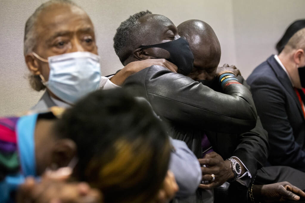 Ahmaud Arbery Georgia Trial Ahmaud Arbery's father Marcus Arbery, center, his hugged by his attorney Benjamin Crump after the jury convicted Travis McMichael in the Glynn County Courthouse, Wednesday, Nov. 24, 2021, in Brunswick, Ga. Greg McMichael and his son, Travis McMichael, and a neighbor, William