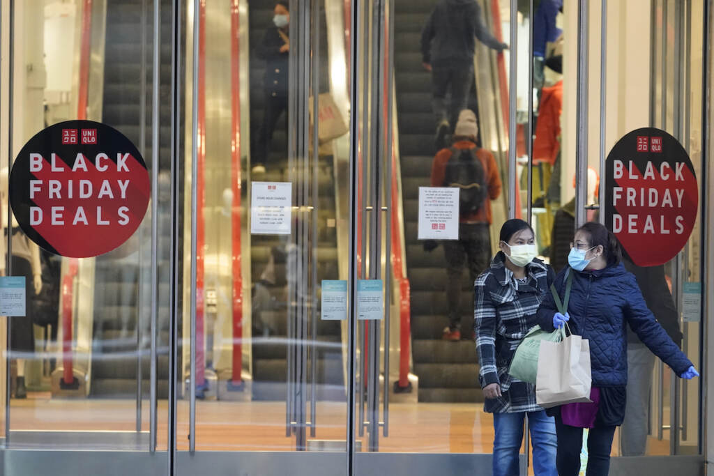 Black Friday Shopping Black Friday shoppers wear face masks and gloves as the leave the Uniqlo store along Fifth Avenue, Friday, Nov. 27, 2020, in New York