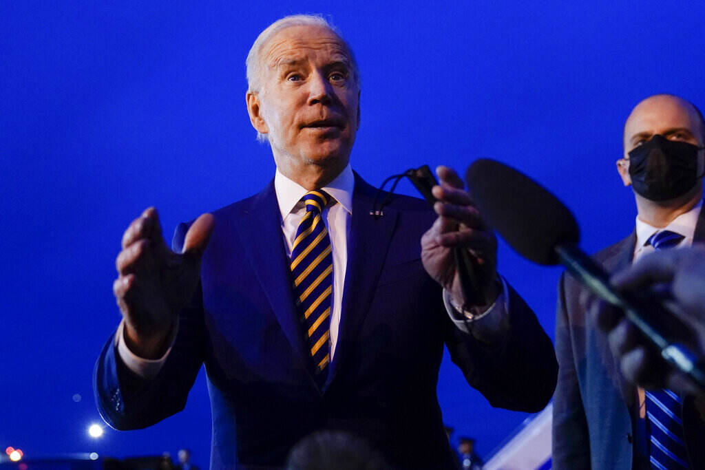 Biden President Joe Biden speaks to members of the media before boarding Air Force One at Minneapolis-Saint Paul International Airport in Minneapolis, Tuesday, Nov. 30, 2021, after visiting Dakota County Technical College in Rosemount, Minn. (AP Photo/Carolyn Kaster)