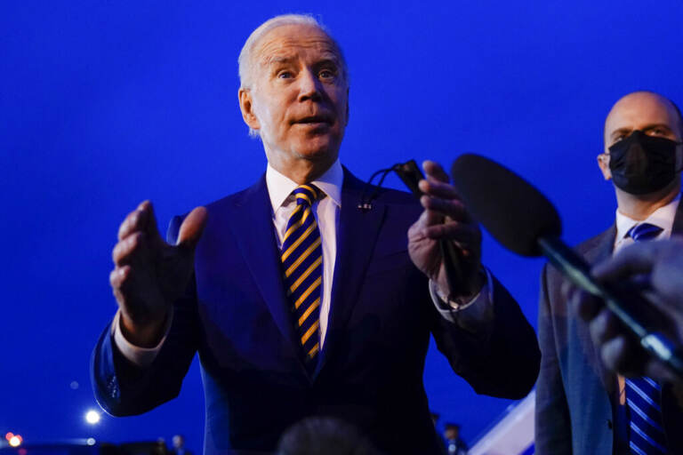President Joe Biden speaks to members of the media before boarding Air Force One at Minneapolis-Saint Paul International Airport in Minneapolis, Tuesday, Nov. 30, 2021, after visiting Dakota County Technical College in Rosemount, Minn. (AP Photo/Carolyn Kaster)
