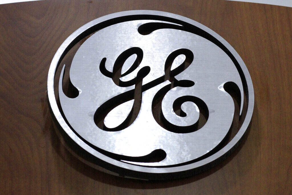 General Electric; GE This Jan. 16, 2014 file photo shows the General Electric logo at a store in Cranberry Township, Pa. (AP Photo/Gene J. Puskar, File)
