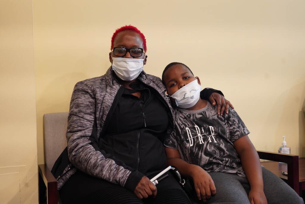 Eva Hayes and her son, Kingston, at the Black Doctors COVID-19 Consortium’s first weekend of vaccinations for younger children at the Dr. Ala Stanford Center for Health Equity (ASHE) in North Philadelphia