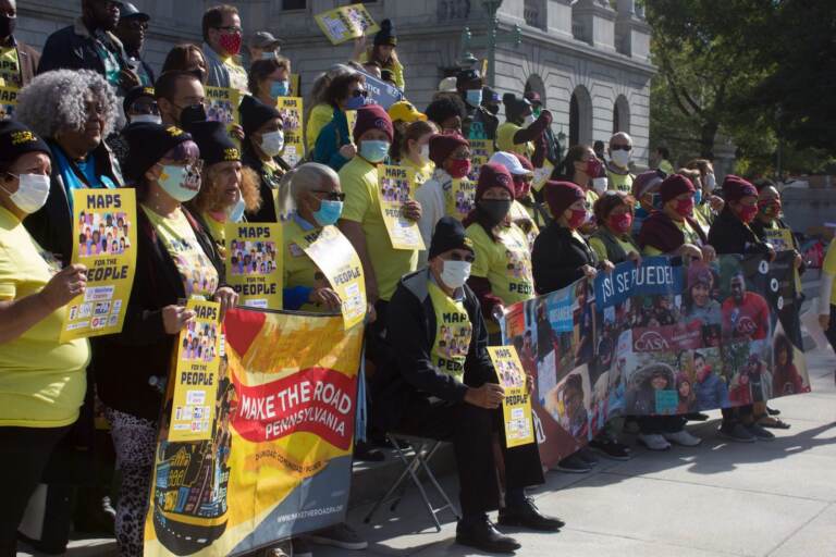 Demonstrators organized by advocacy group Pennsylvania Voice rally on the steps of the state Capitol on Oct. 28, 2021. (Gabriela Martínez / WITF)