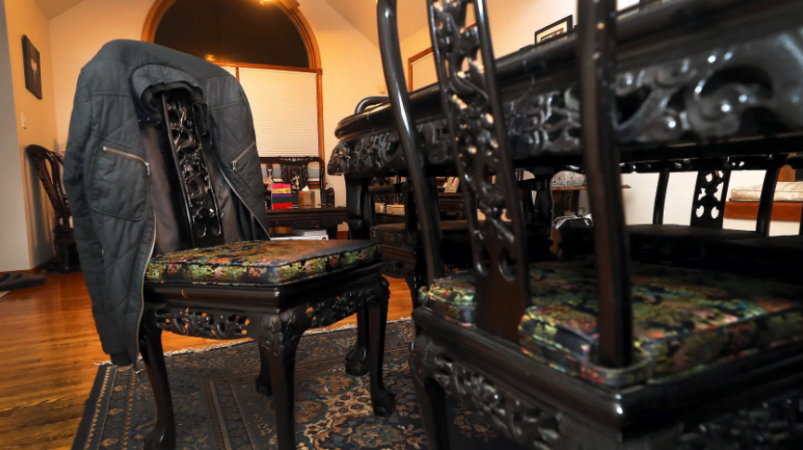 Gareth and Fe Hall have left many of Christian's possessions where he last placed them before his death, including a jacket that still hangs on a dining room chair. (Fred Adams for Spotlight PA)