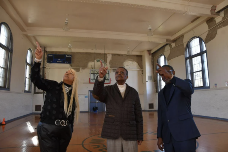 From left, Revs. Jeanette Davis, Robert Collier Sr. and Greg Holston show ceiling damage in the Waterview Recreation Center's Gym in Northwest Philadelphia. (Abdul R. Sulayman/ The Philadelphia Tribune).