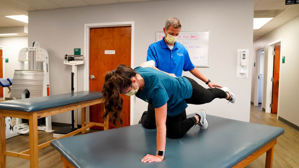 Brian Catania works aide Taylor Putnam Brian Catania works aide Taylor Putnam through the Row Dog, one of the six core activation exercises he and Travis Ross developed.