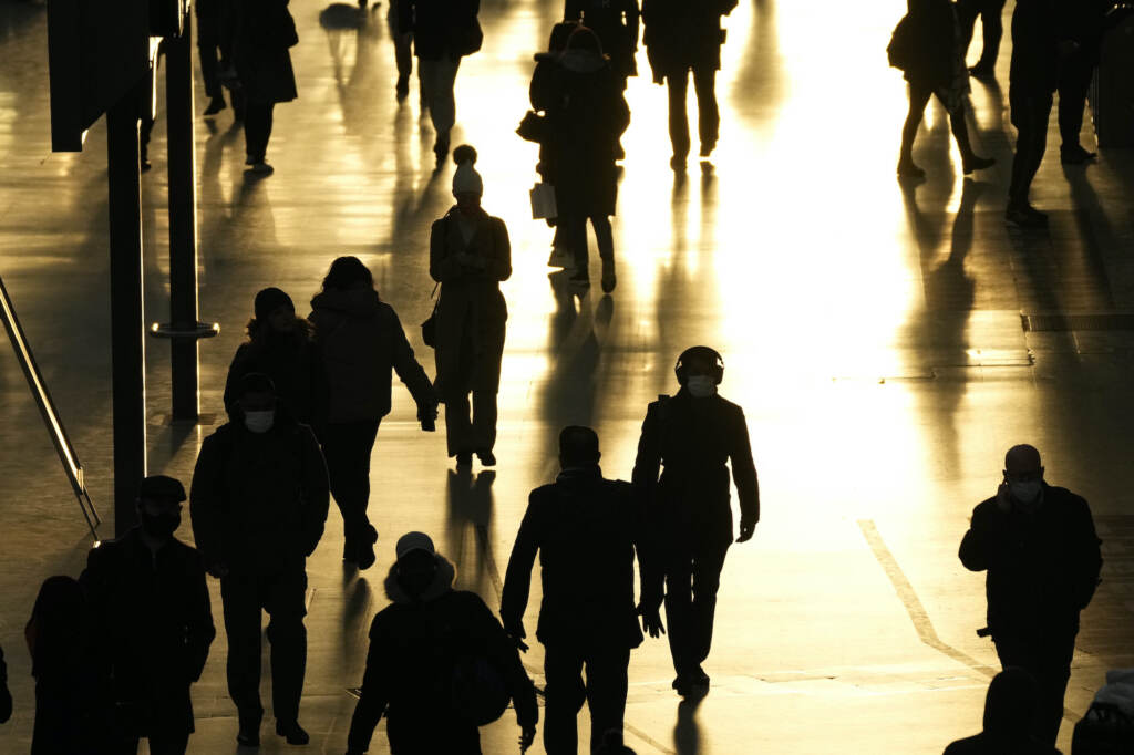 People pass through Waterloo train station