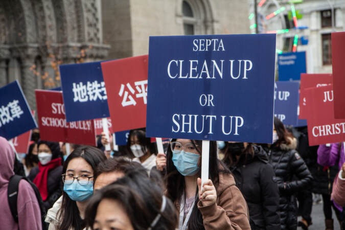 Signs are pictured from an anti-violence rally that say 