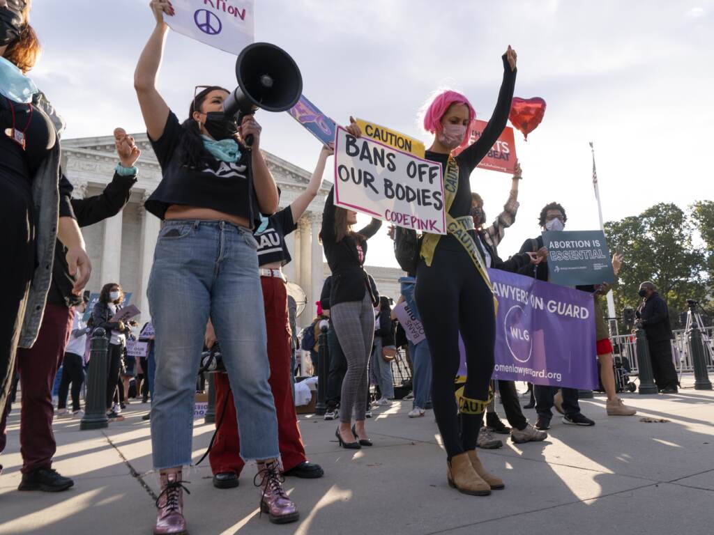 Pro-abortion rights and anti-abortion activists rally outside the Supreme Court on Monday, as the justices heard arguments about Texas’s controversial abortion law. Pro-choice and anti-abortion activists rally outside the Supreme Court, Monday, Nov. 1, 2021, as arguments are set to begin about abortion by the court, on Capitol Hill in Washington. (AP Photo/Jacquelyn Martin)