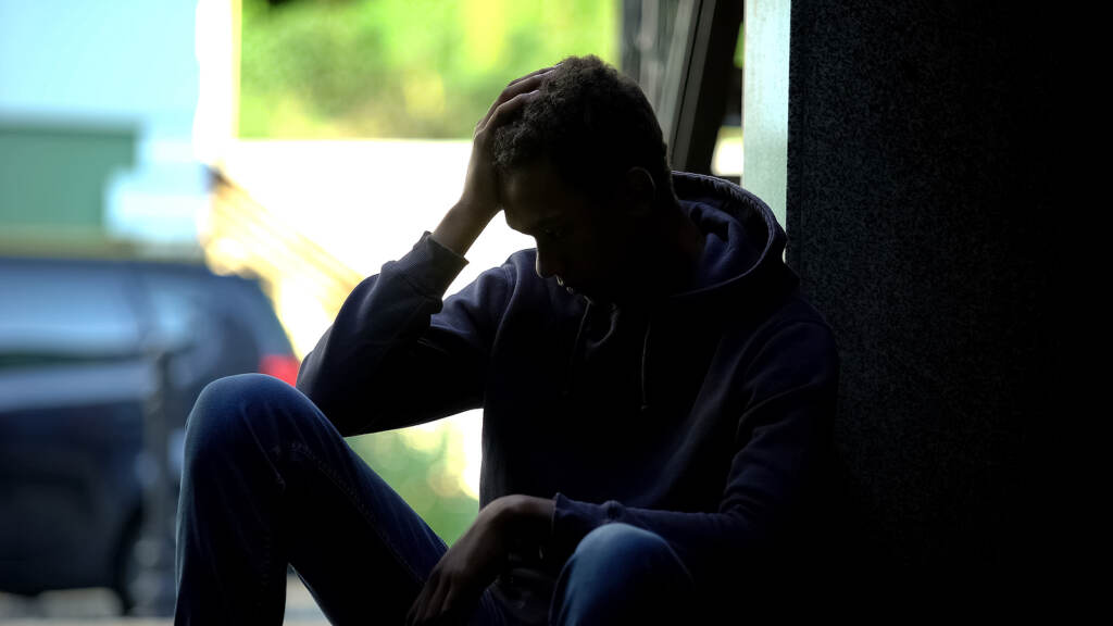 teen depression Depressed teen sitting in the dark