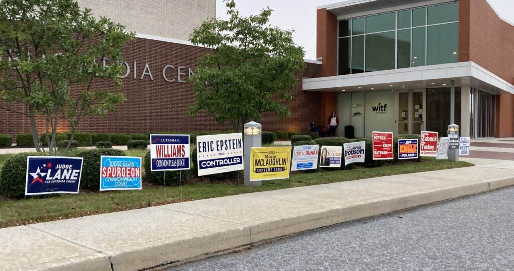 Candidate yard signs line the entrance to WITF's Public Media Center during the Nov. 2, 2021 election. The station building serves as a polling place for voters in Dauphin County. (Sam Dunklau / WITF)